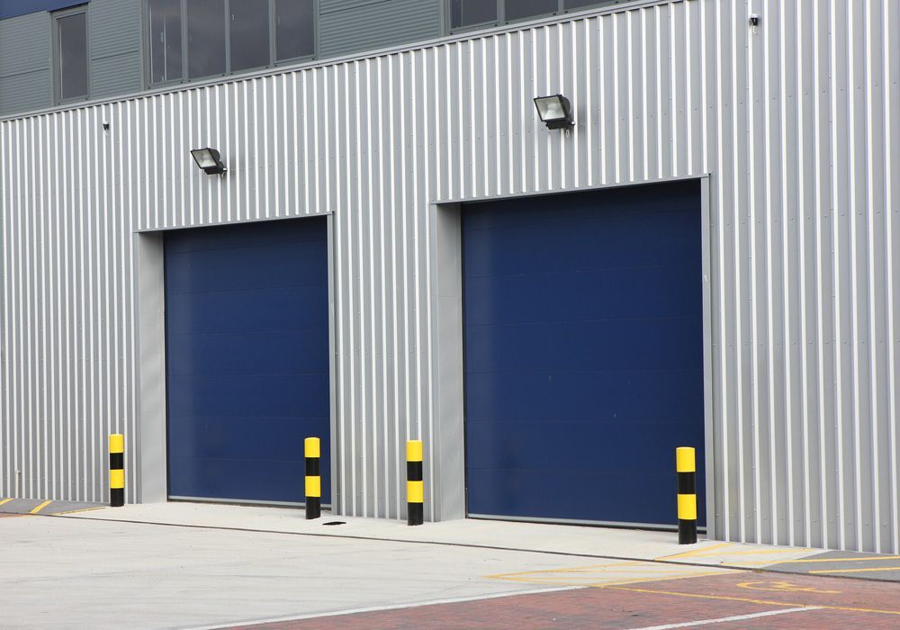 A Blue Commercial Roller Shutters — Darwin Roller Door Services In Tivendale NT