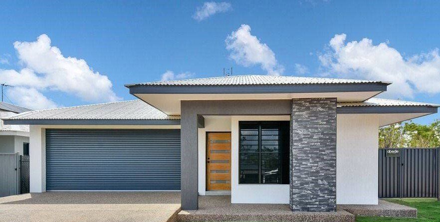 Modern House With Roller Shutter Doors — Darwin Roller Door Services In Tivendale NT