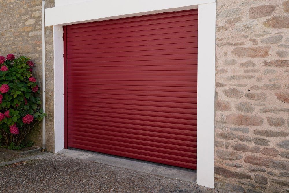 Red Garage Roller Door Of A House — Darwin Roller Door Services In Tivendale, NT