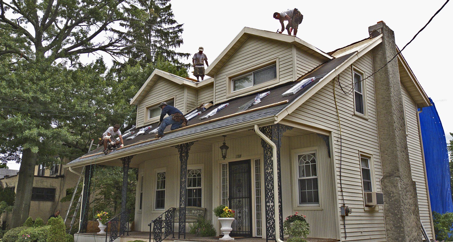 roofers working on house