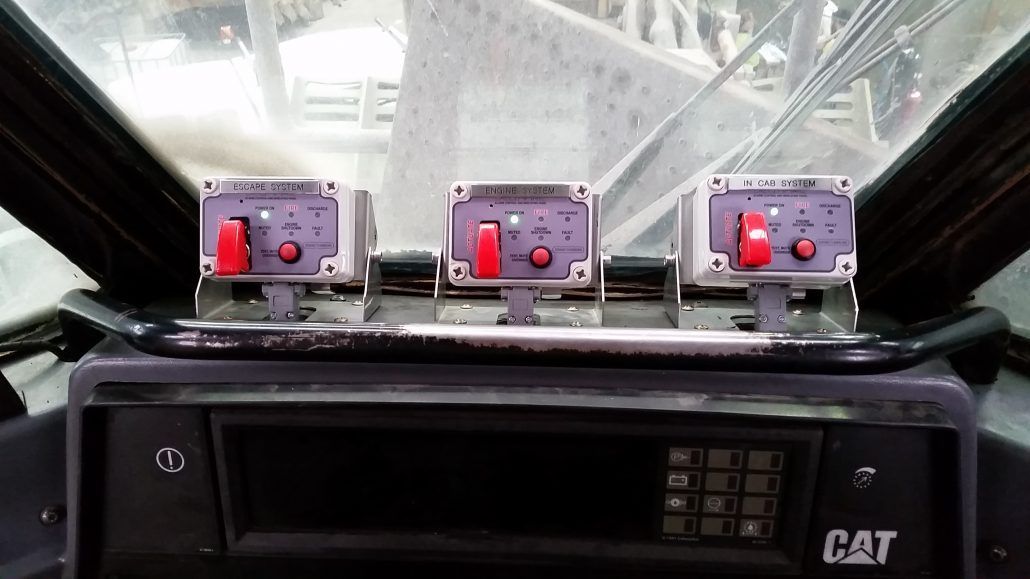 A close up of the dashboard of a cat truck.