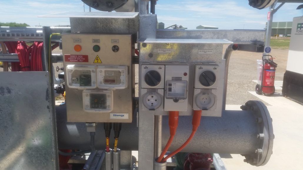 A close up of a machine with a lot of wires coming out of it.