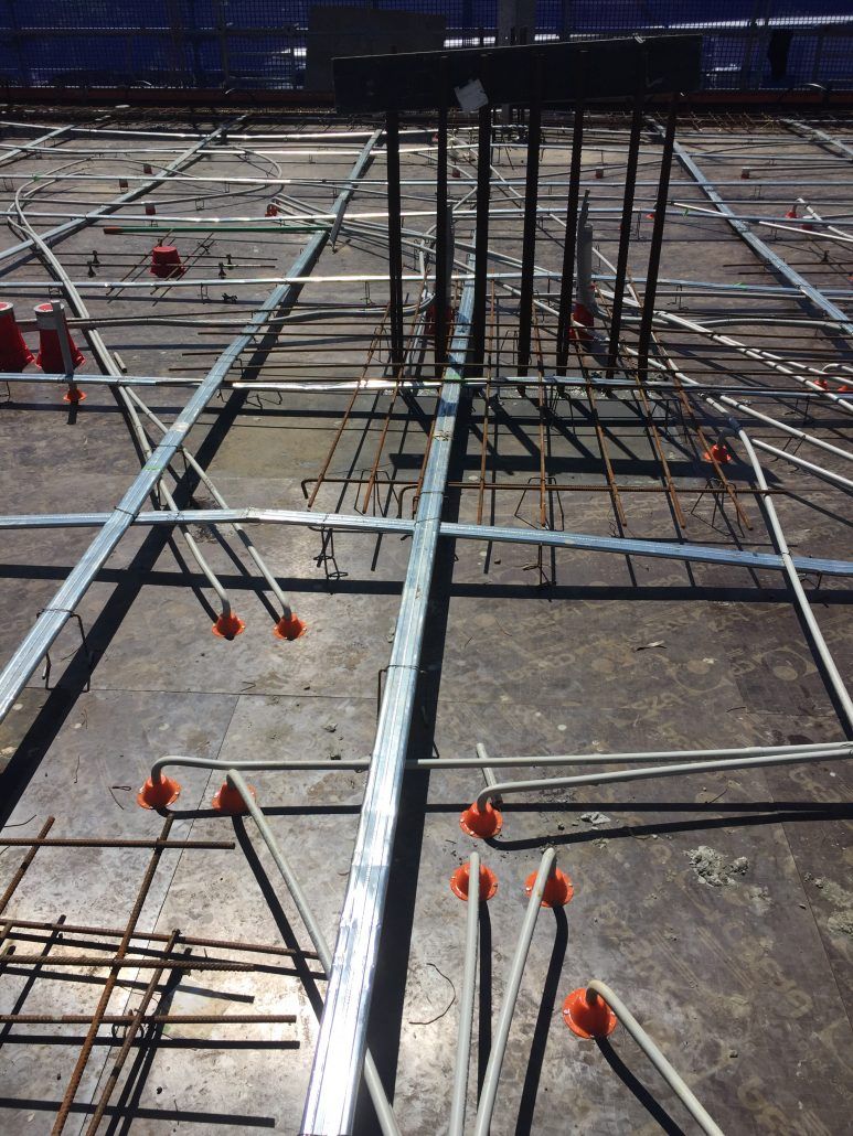 A construction site with a lot of metal rods and wires