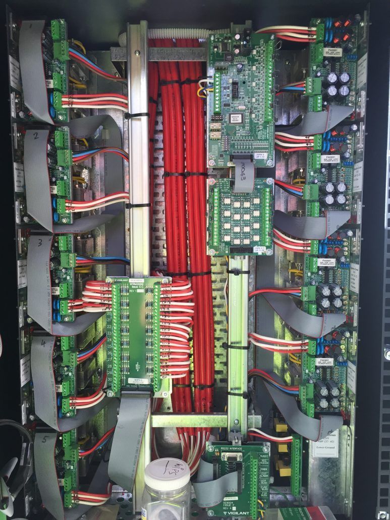 The inside of a computer with a lot of wires coming out of it