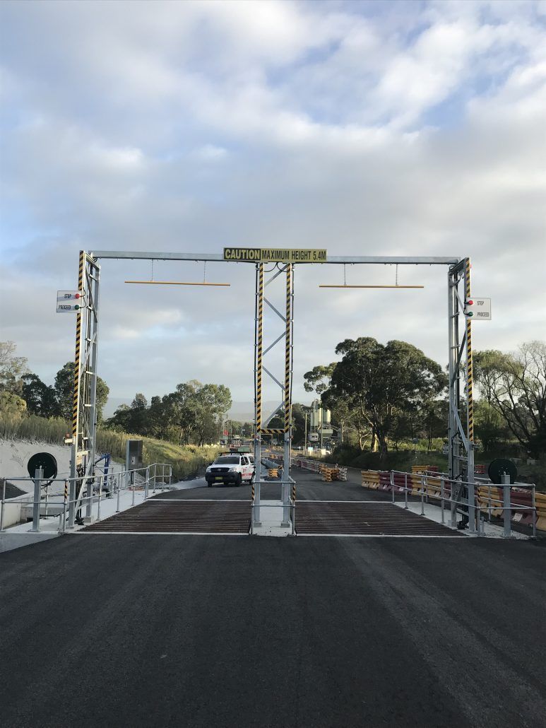 A road with a yellow sign that says ' sydney ' on it