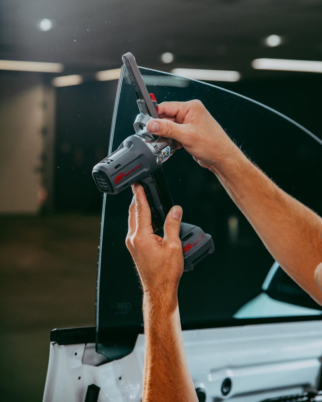 A close up of a car window with a sticker on it.