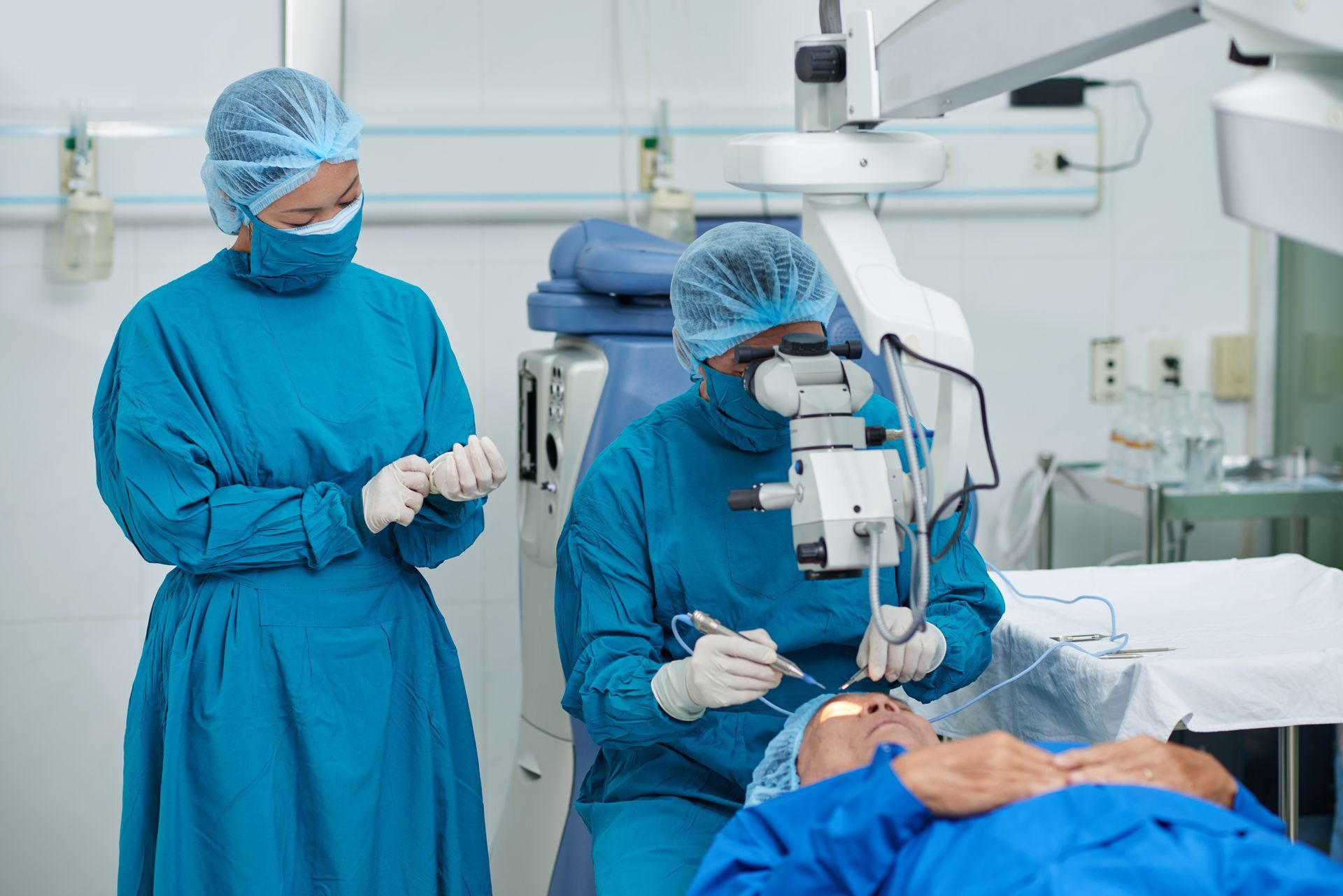 A group of ophthalmologists in the process of cataract surgery in a modern clinic.