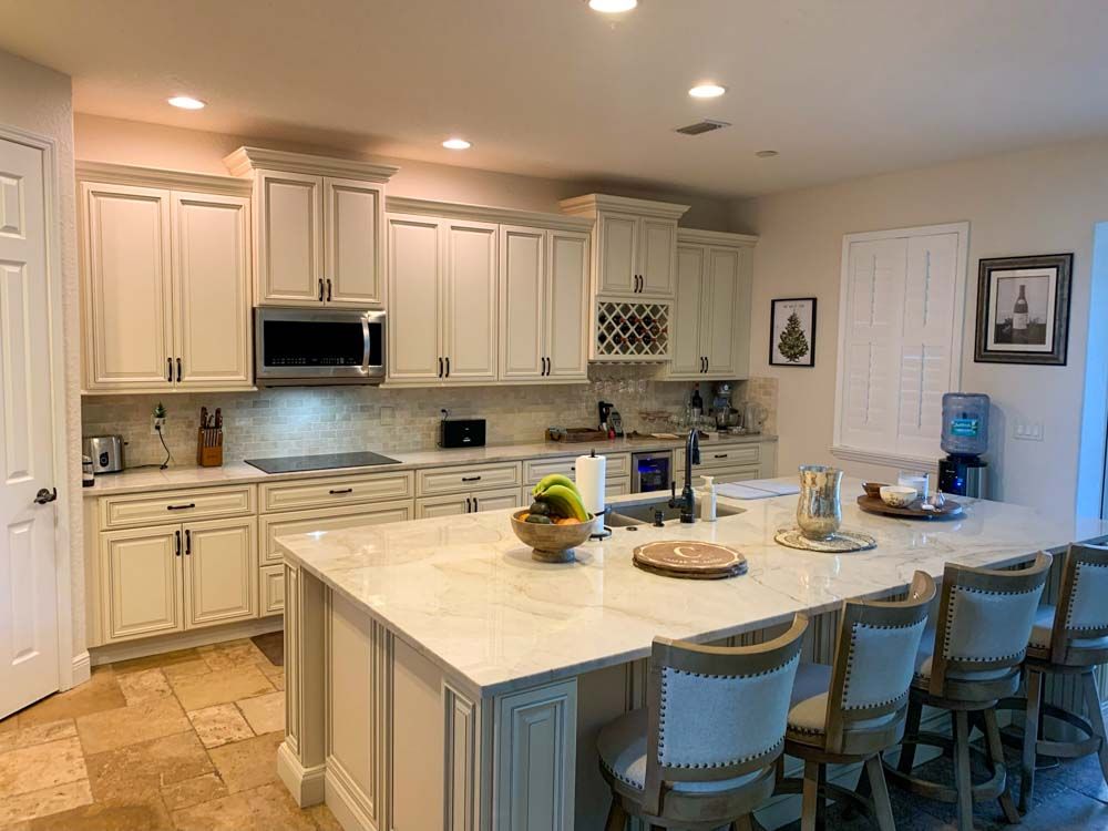 There is a large island in the middle of the kitchen.