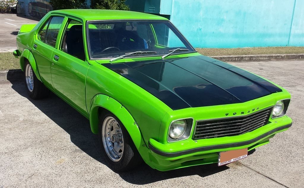 Bright green classic car with black hood parked on pavement — Pialba Brake Clutch & Steering in Pialba, QLD