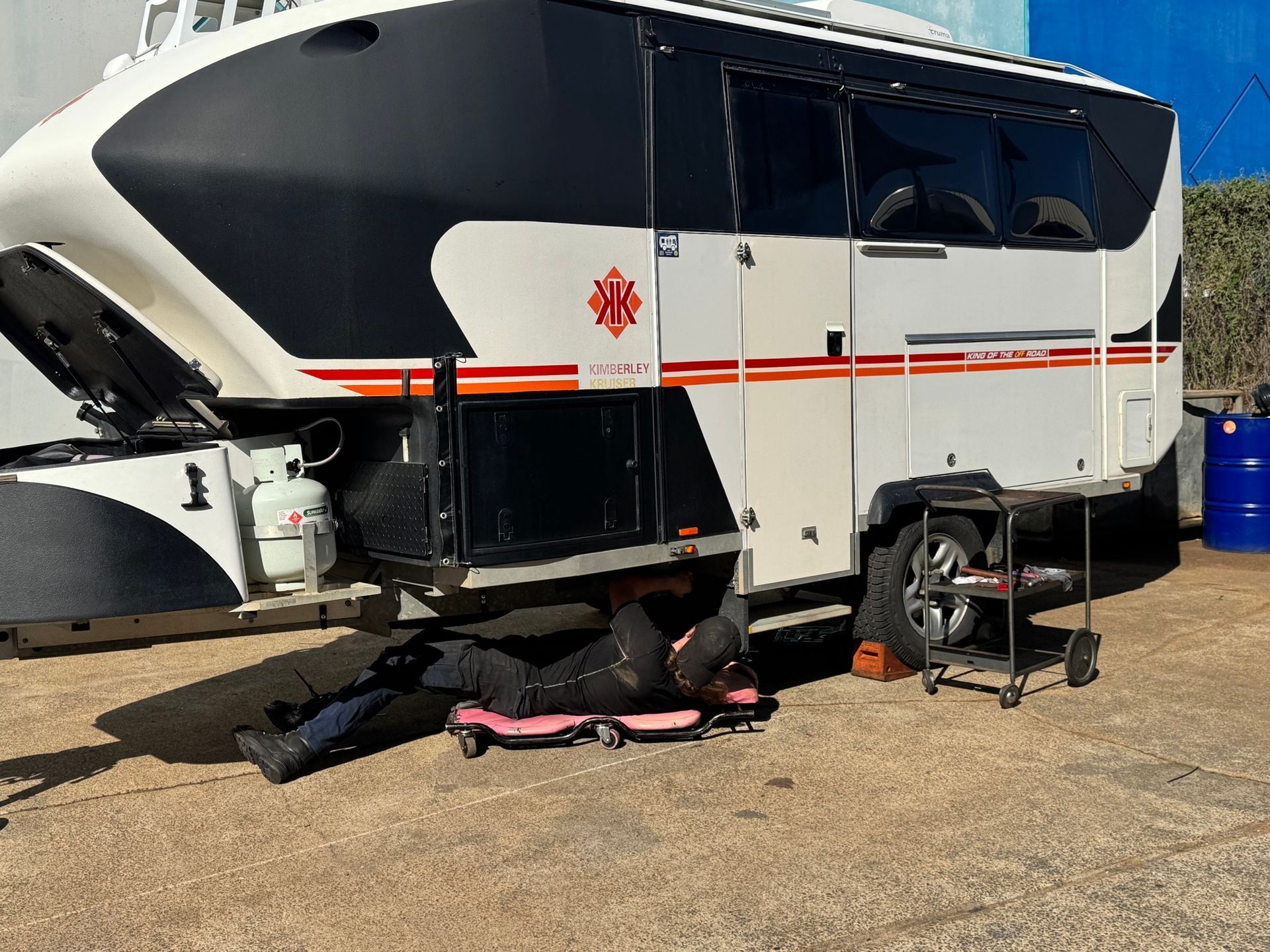A White Caravan is Parked in a Gravel Lot — Pialba Brake Clutch & Steering in Pialba, QLD