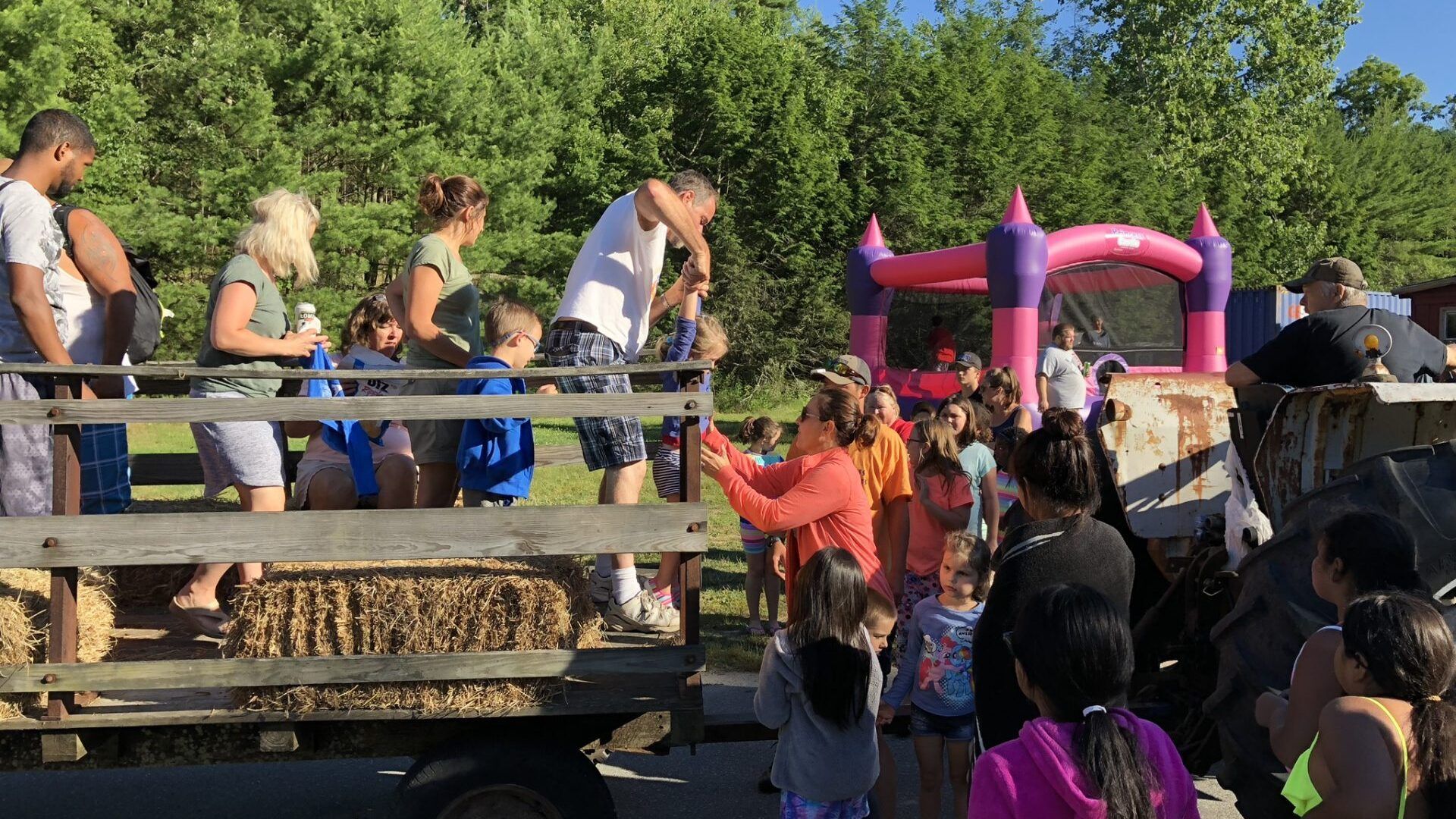 A group of people are riding in the back of a truck.