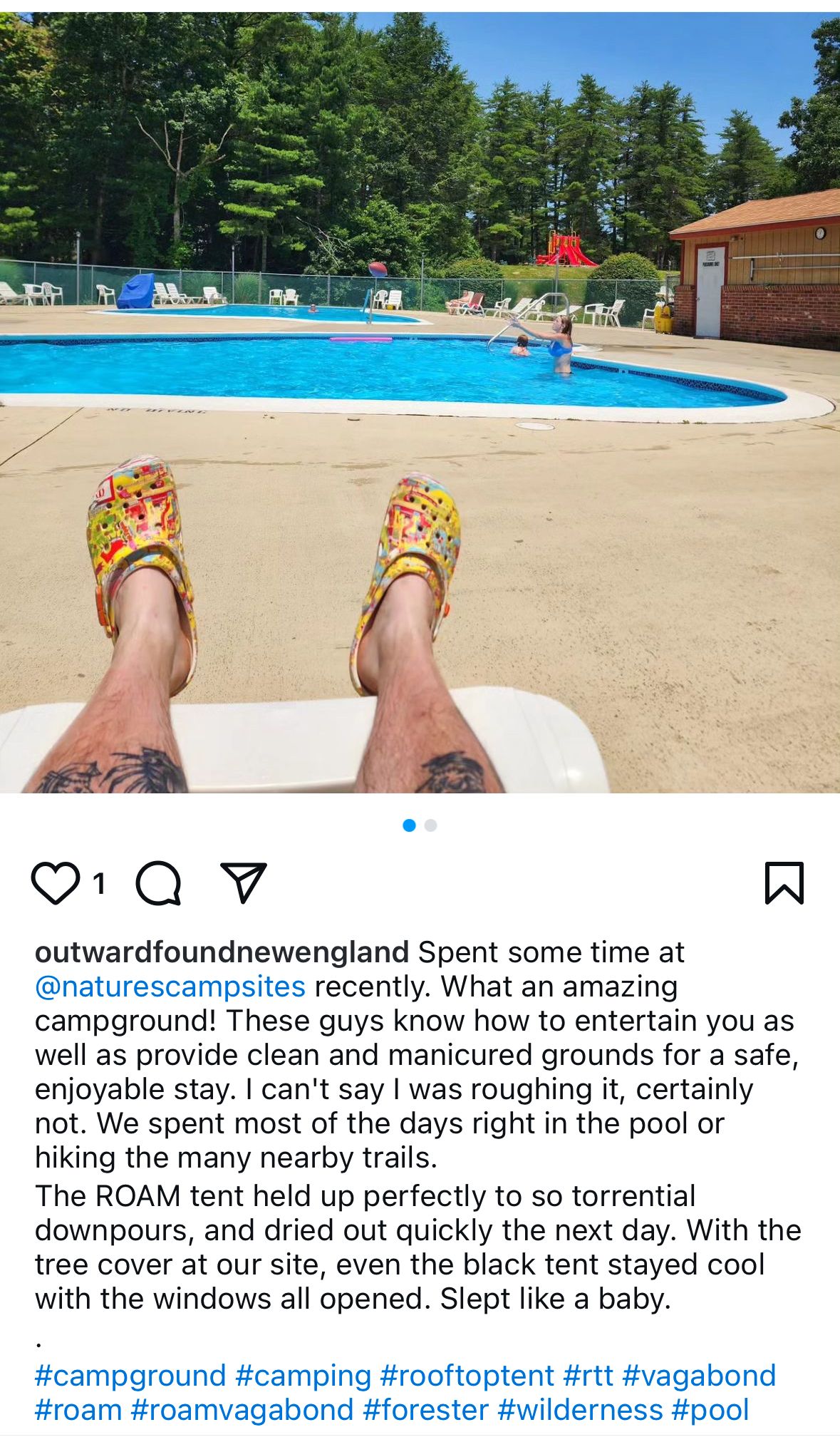 A person is laying on a chair next to a swimming pool.