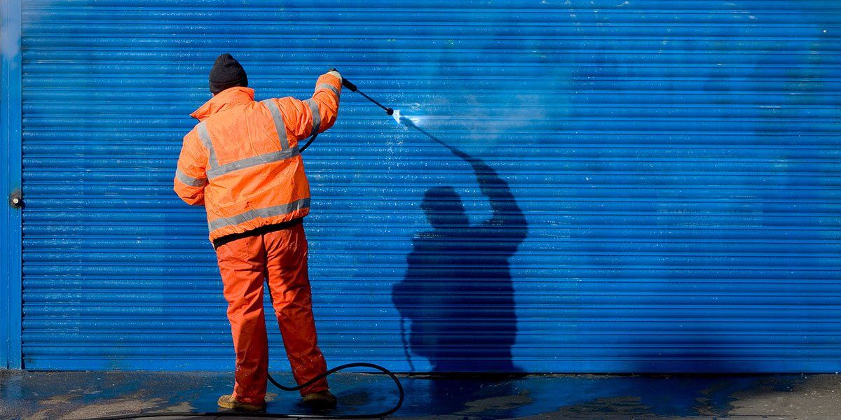 Cleaning Graffiti Off a Security Grill — Newcastle, NSW — HCS Hunter Cleaning Service