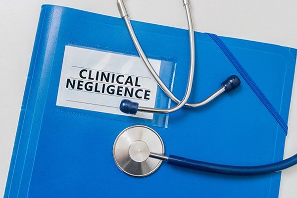 Blue Folder with Clinical Negligence — Turners Falls, MA — Dolan & Dolan