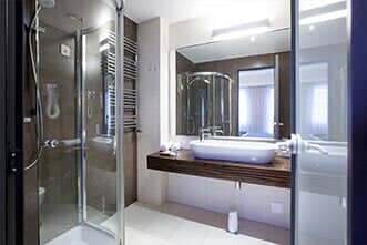 Modern bathroom in hotel shot from shower cabin - Glass Repair and Services in New Bedford, MA
