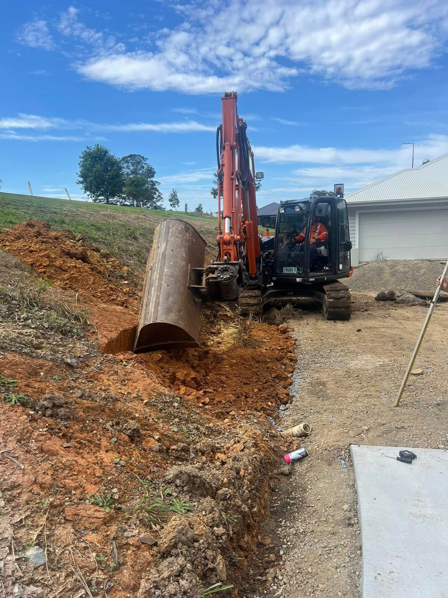 Excavator Digging a Trench on a Construction Site — MG Earthworks and Plant Hire in Bellingen, NSW