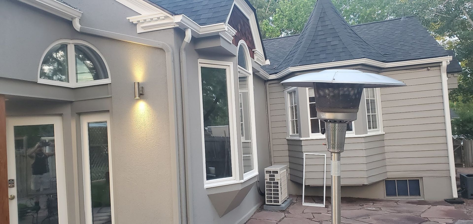 A house with a patio heater in front of it.