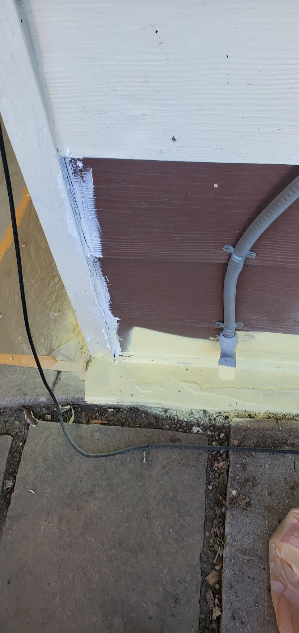 A close up of a door with a pipe coming out of it.
