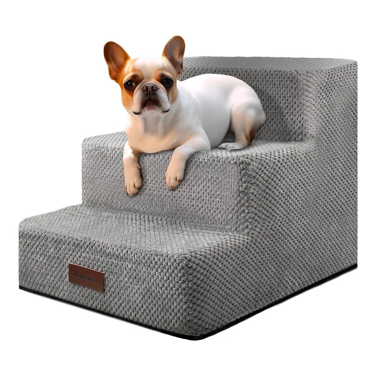 A small dog is laying on a set of stairs