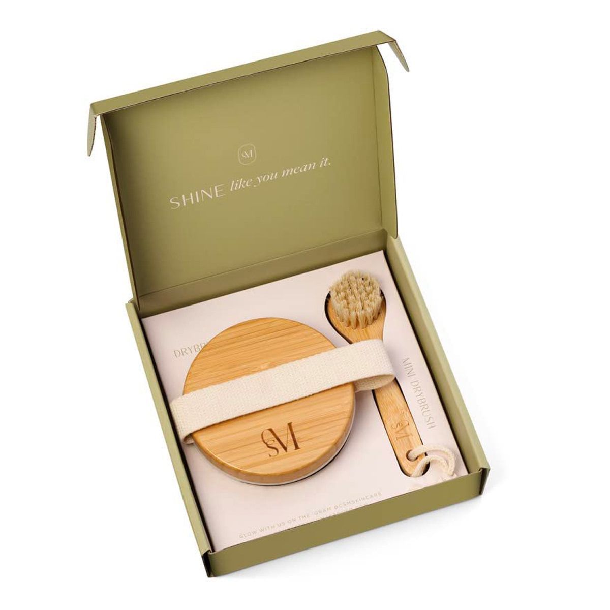 A box with a brush and a spoon in it