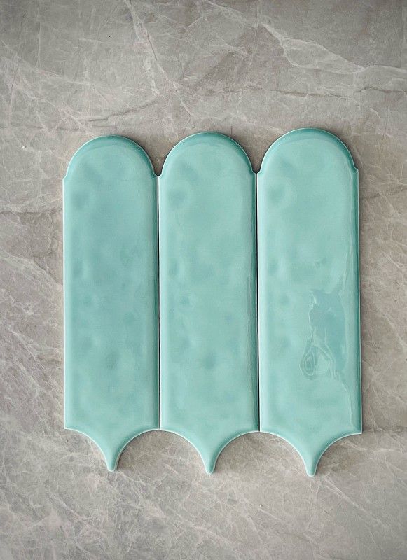 A Close Up Of Three Mint Green Tiles On A Marble Surface — Tile Centre NT In Winnellie, NT