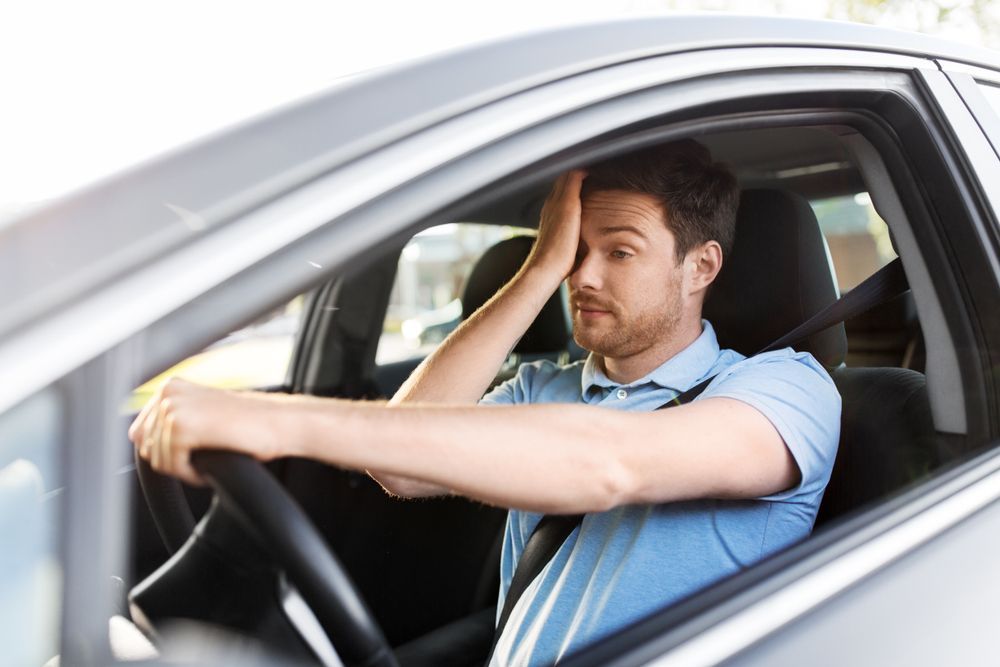 Man in a Blue Shirt Driving a Car — Peninsula Eyecare Izzards Optometrists in Woy Woy, NSW