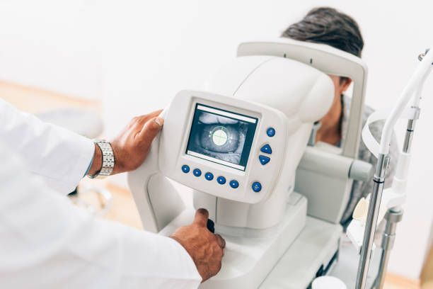 An Eye Doctor Performing an Eye Exam on a Patient — Peninsula Eyecare Izzards Optometrists in Umina Beach, NSW