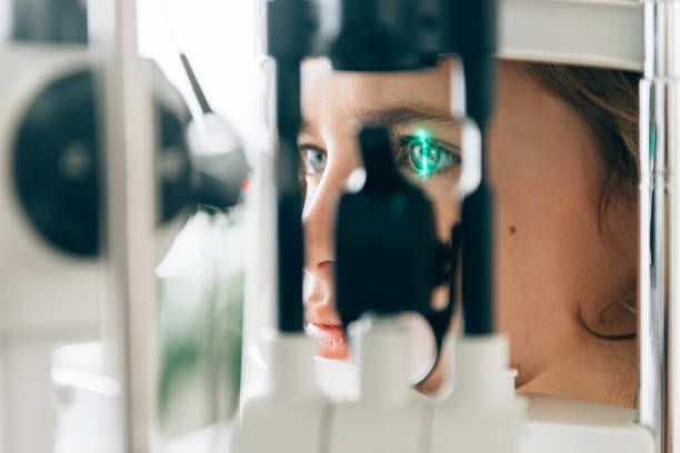 Close-up of a Person Undergoing a Vision Test, With a Green Light — Peninsula Eyecare Izzards Optometrists in Woy Woy, NSW