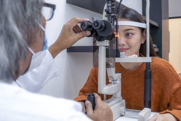 An Optometrist Uses a Slit Lamp Microscope — Peninsula Eyecare Izzards Optometrists in Ettalong, NSW