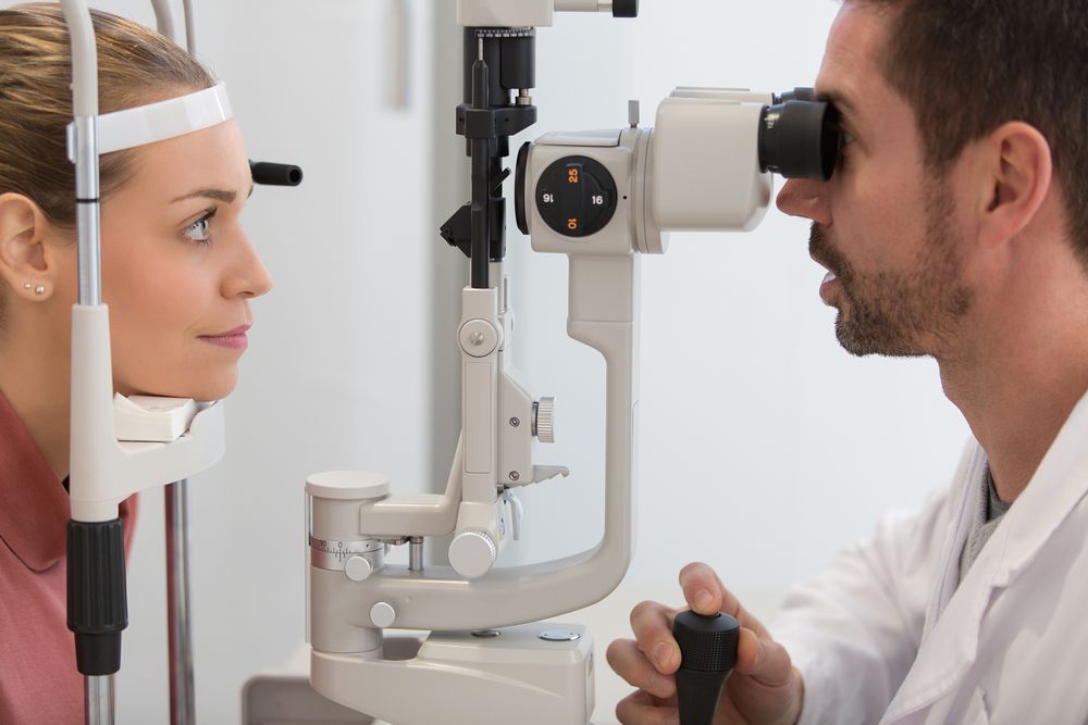 An Eye Care Professional Uses a Slit Lamp Microscope — Peninsula Eyecare Izzards Optometrists in Tascott, NSW