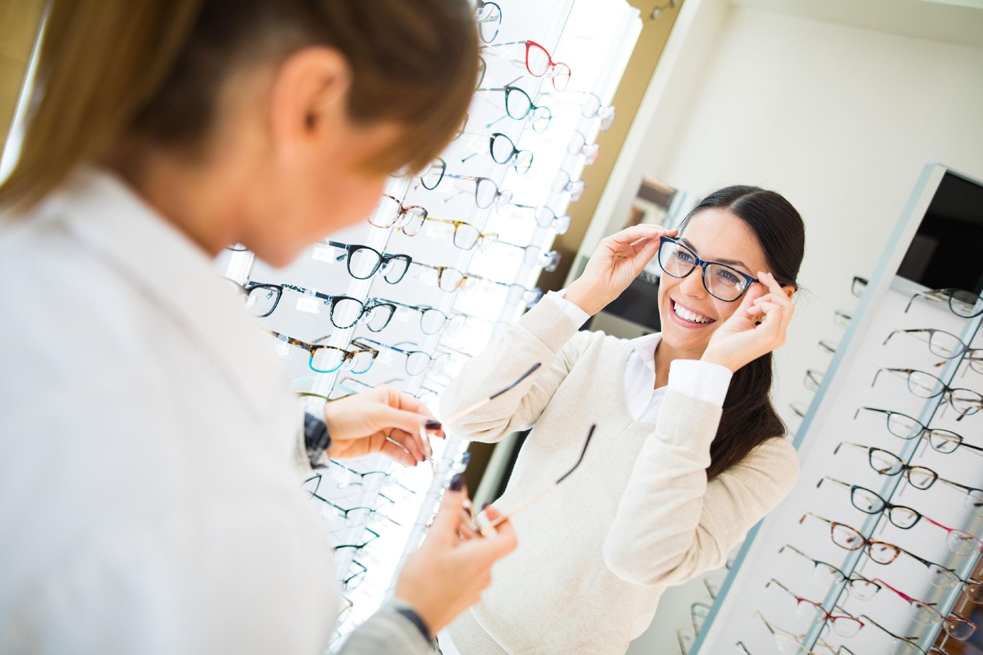 A Person Tries on Glasses in an Optical Shop — Peninsula Eyecare Izzards Optometrists in Woy Woy, NSW