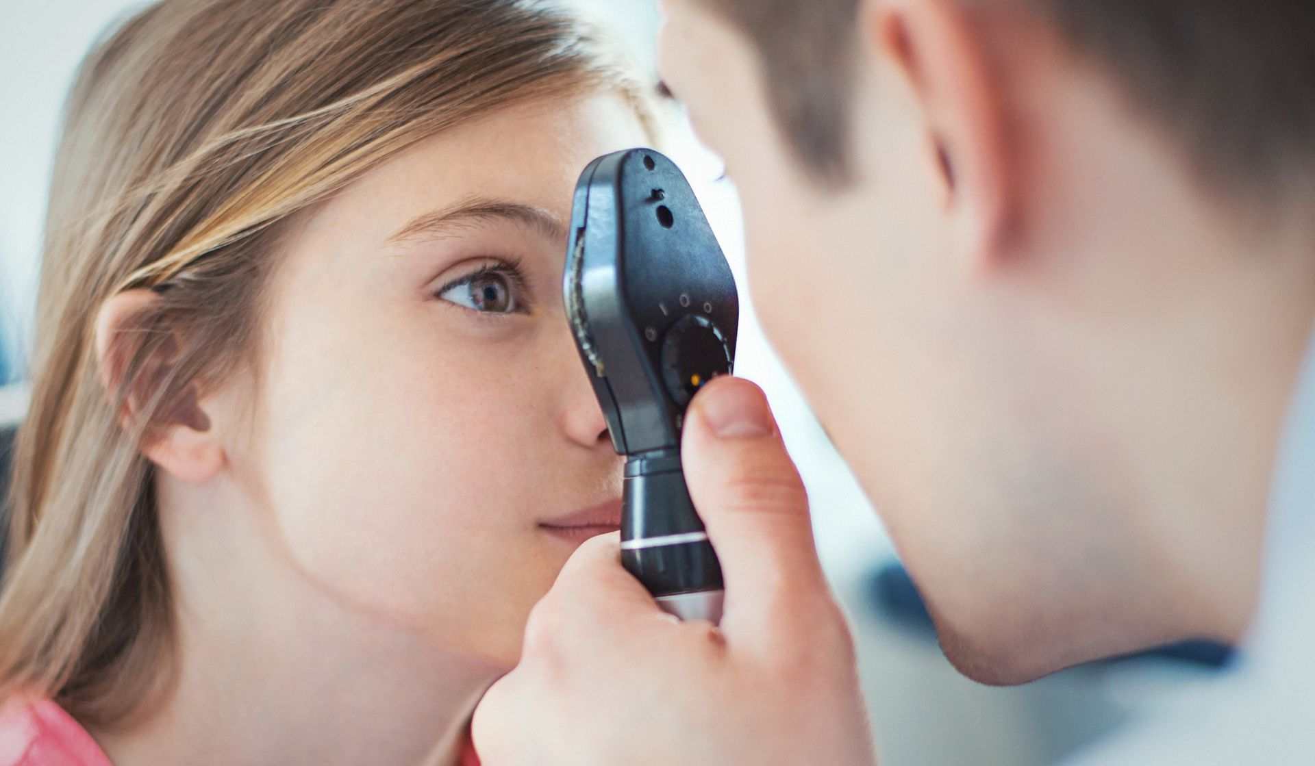 A Healthcare Provider Uses an Ophthalmoscope — Peninsula Eyecare Izzards Optometrists in Woy Woy, NSW