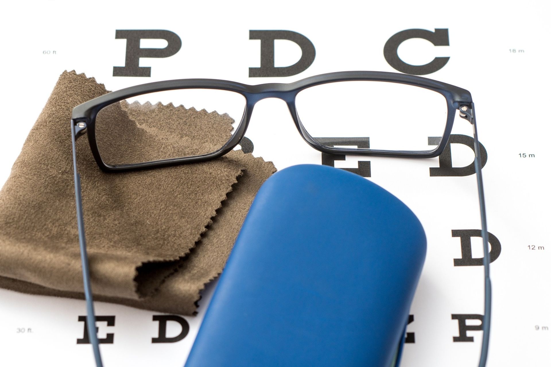 Eyeglasses, a Blue Case, and a Cleaning Cloth — Peninsula Eyecare Izzards Optometrists in Woy Woy, NSW