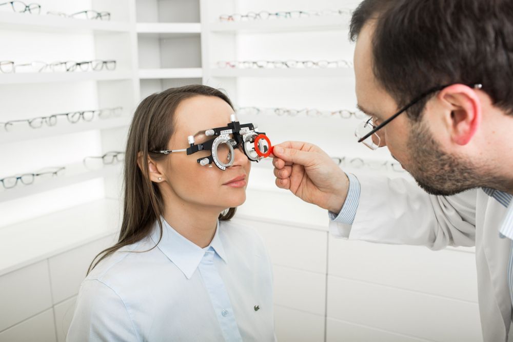 An Optometrist Adjusts a Trial Frame on a Patient — Peninsula Eyecare Izzards Optometrists in Kariong, NSW