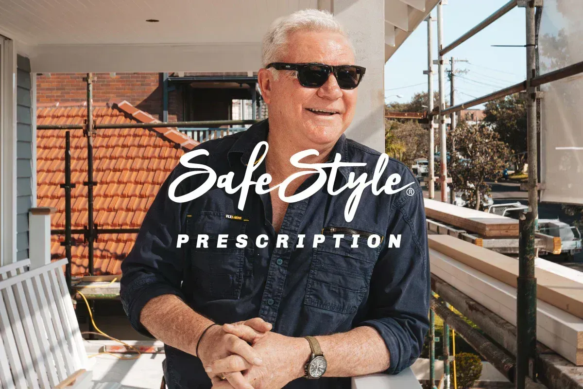 Smiling Man in Sunglasses Seated Outdoors — Peninsula Eyecare Izzards Optometrists in Woy Woy, NSW