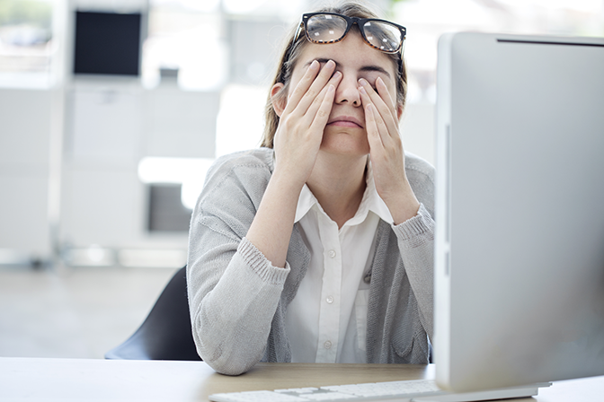 Frustrated Office Worker Rubbing Eyes — Peninsula Eyecare Izzards Optometrists in Woy Woy, NSW
