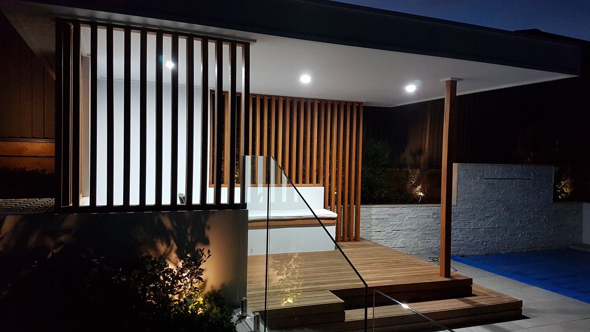 A Large House With a Lot of Windows is Lit Up at Night — Gunter Electrical In Kariong, NSW