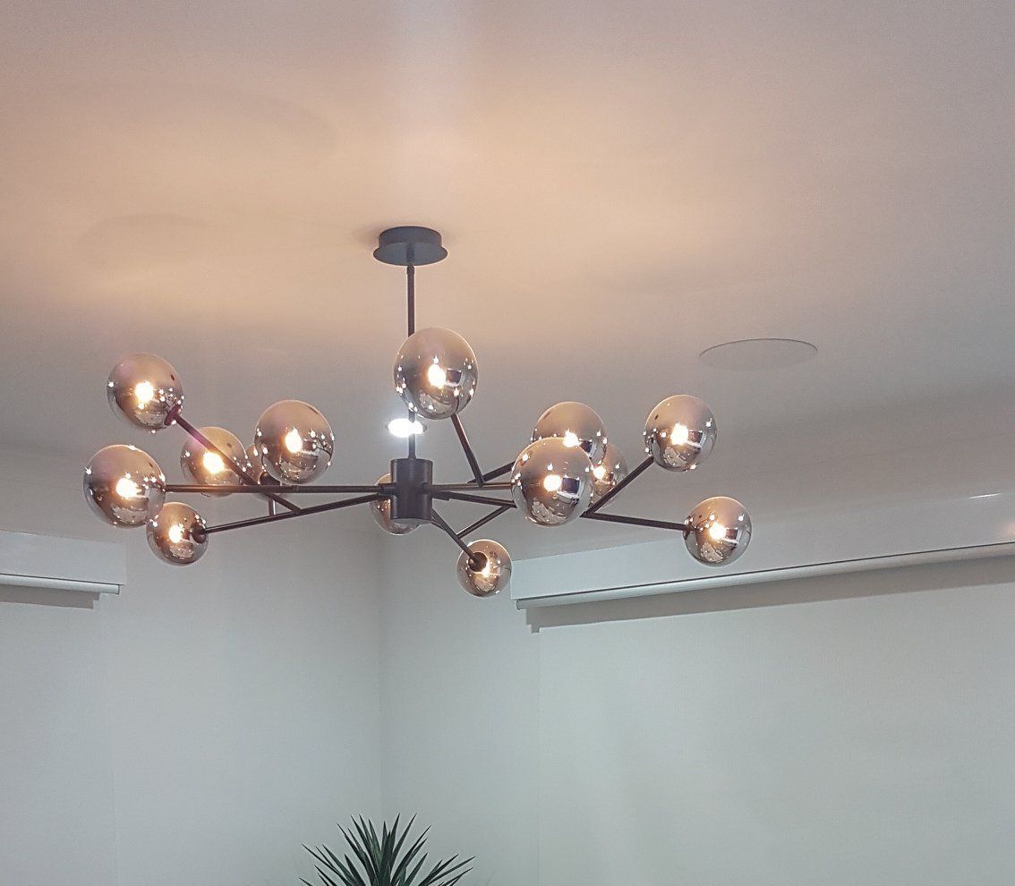 A Man is Working on an Electrical Panel With a Multimeter — Gunter Electrical In Wyong, NSW