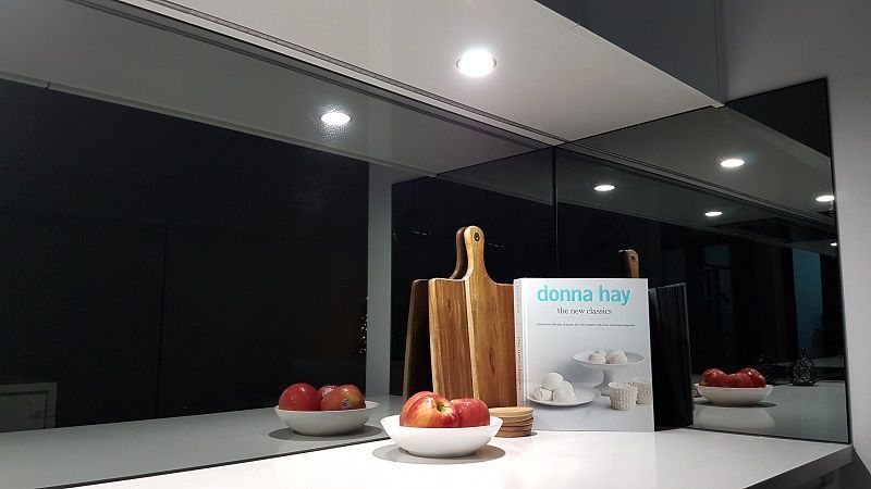 A Kitchen Counter With a Bowl of Apples and a Book on It — Gunter Electrical In Kariong, NSW