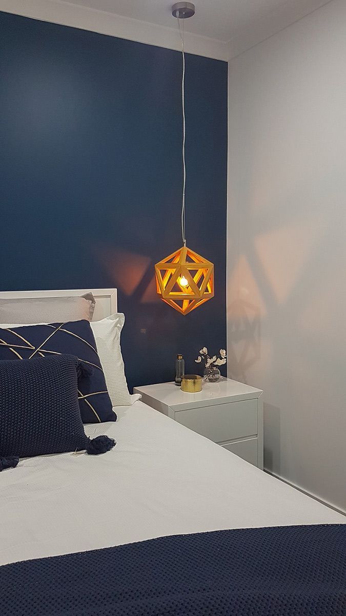 A Dining Room With a Table and Chairs and a Chandelier Hanging From the Ceiling — Gunter Electrical In Kariong, NSW