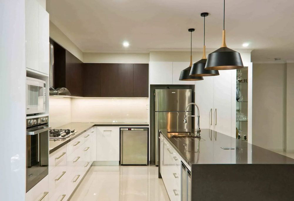 A Kitchen With White Cabinets — Designer Kitchens in Berrimah, NT