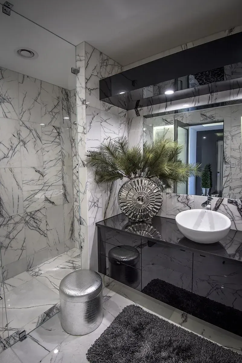 A Bathroom With a Sink, Mirror and Walk in Shower — Designer Kitchens in Berrimah, NT