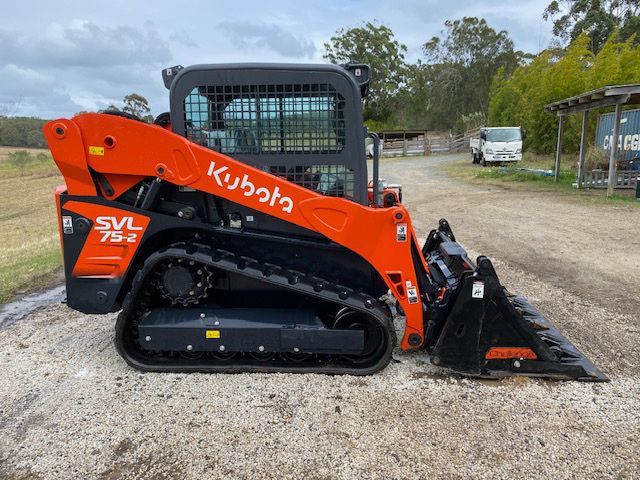 Side Left Black And Orange Positrack — Positrack & Bobcat Hire in Boomerang Beach, NSW