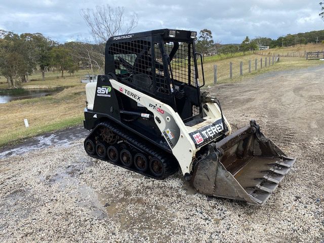 Side Left Black And White Positrack — Positrack & Bobcat Hire in Boomerang Beach, NSW