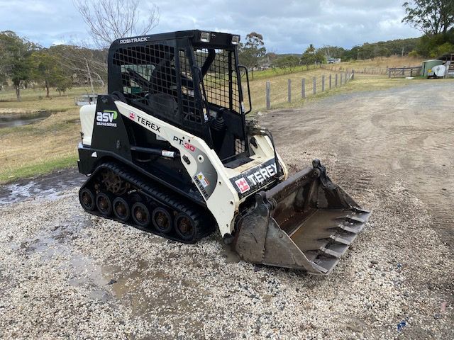 View Side Left Black And White Positrack — Positrack & Bobcat Hire in Boomerang Beach, NSW