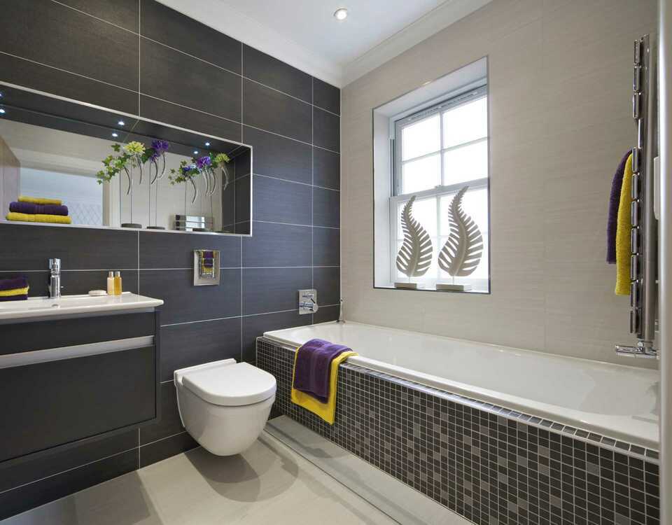 A bathroom with a toilet , sink , and bathtub