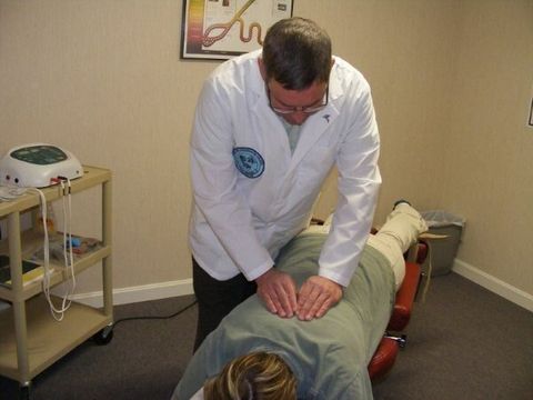 Chiropractor — Certified Chiropractor with His Patient in Amesbury, MA
