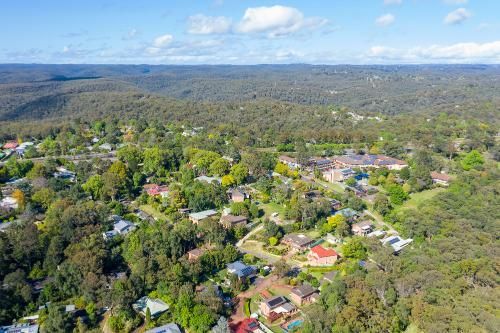 An Aerial View of a Residential Area Surrounded by Trees and Houses — Blind Outfitters in Mareeba, QLD