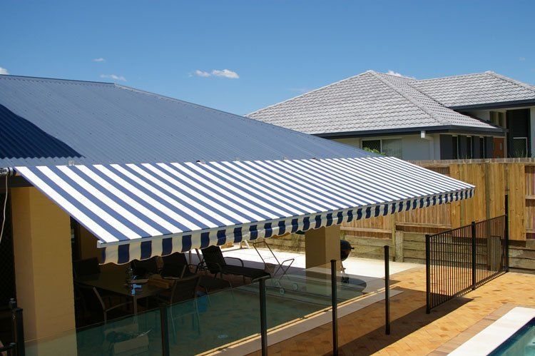 Blue and White Striped Awning Over a Swimming Pool — Blind Outfitters in Mt Garnet, QLD