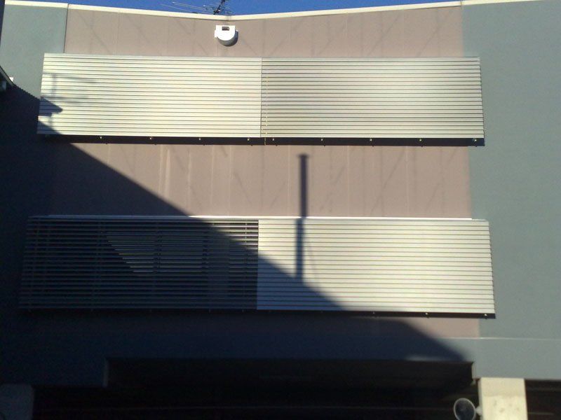 Building With a Lot of Blinds on It — Blind Outfitters in Atherton, QLD